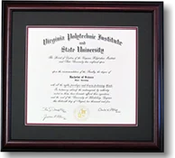 A Virginia Tech diploma in a dark moulding with a black and maroon double mat.
