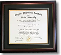 A Virginia Tech diploma in a wide dark moulding with a layered mat.
