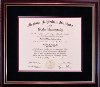 A Virginia Tech diploma on black suede matting with a maroon inner mat.